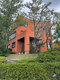 a house with trees in the background