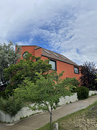 a house with trees in the background