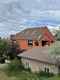 a house with trees in the background