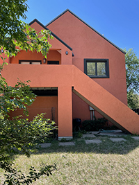 a house with trees in the background