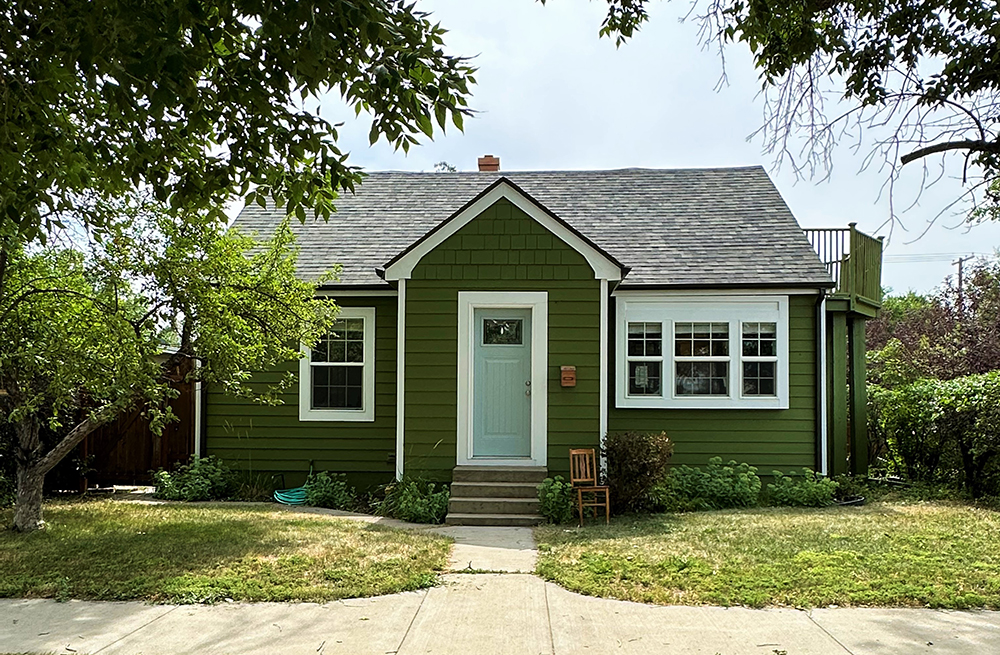 a house with trees in the background