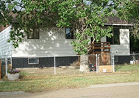 a house with trees in the background