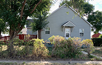 a house with trees in the background