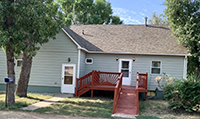 a house with trees in the background