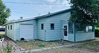 a house with trees in the background