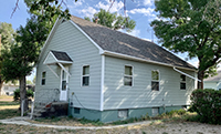 a house with trees in the background