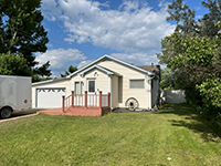 a house with trees in the background