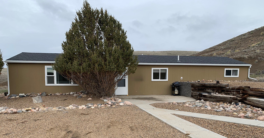 a house with trees in the background