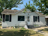 a house with trees in the background