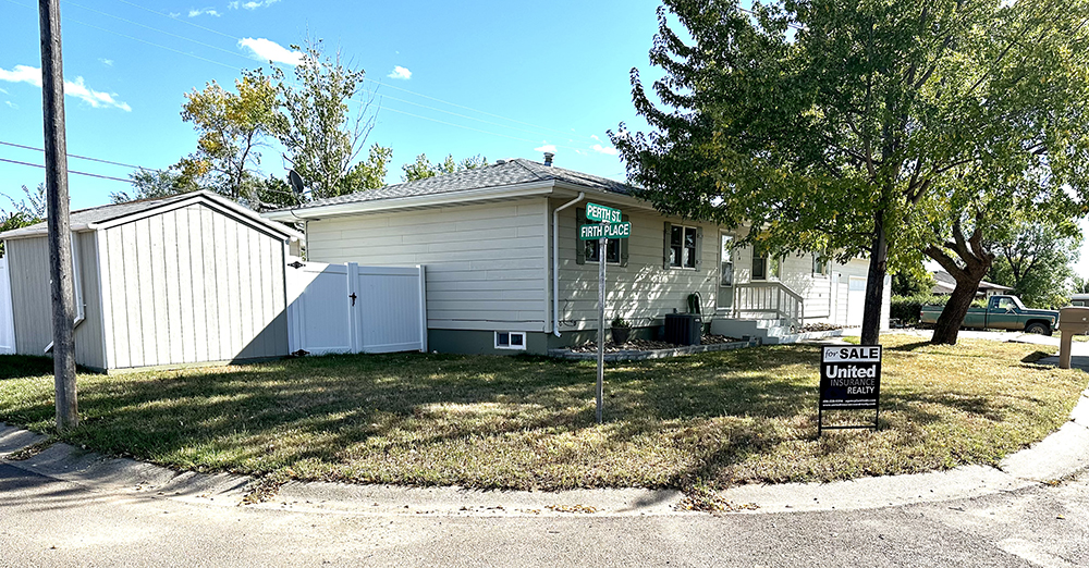a house with trees in the background