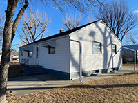 a house with trees in the background