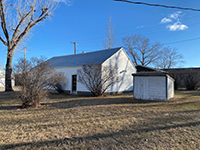 a house with trees in the background