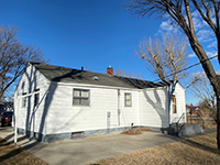 a house with trees in the background